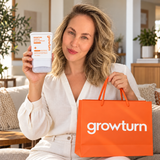 Woman holding GROWTURN scalp serum and an orange GROWTURN bag